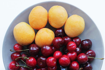 plate with apricots and cherry