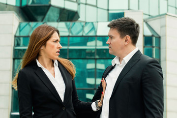 Sexual harassment. Business woman denying approach from her colleague