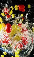 Fototapeta na wymiar merry tomatoes and grape in water