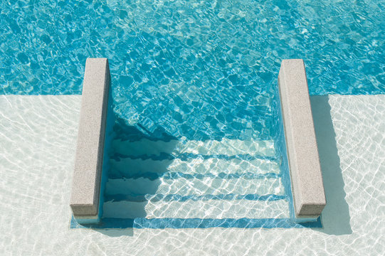 Swimming pool with steps down to the pool