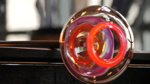 Glassworks glass manufacturing process - glass rolling on the marver