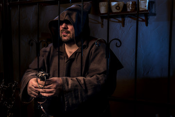 Ancient monk prisoner in castle prison