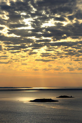 cirrus clouds at sunset over the river