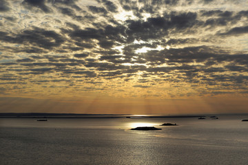 cirrus clouds at sunset over the river