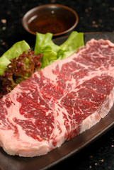 Premium raw japanese kobe beef sliced on plate