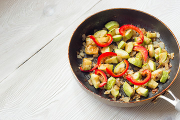 Mix of fried vegetables on frying pan