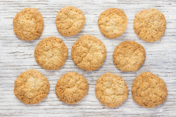 Oatmeal cookies on a light wooden background