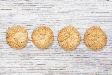 Oatmeal cookies on a light wooden background