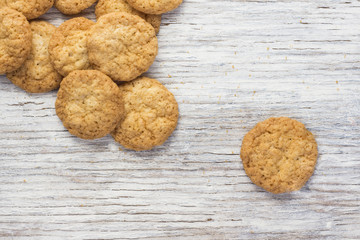Oatmeal cookies on a light wooden background