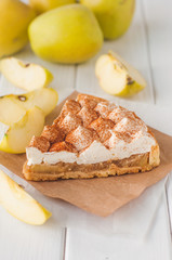 Apple pie with whipped cream covered by grated chocolate