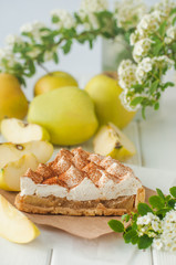 Apple pie with whipped cream covered by grated chocolate