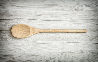 One wooden spoon on the table