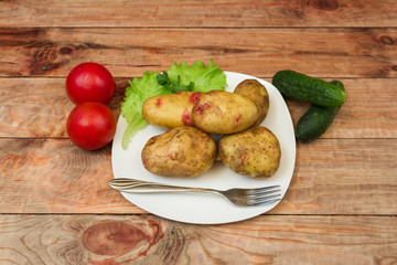 potatoes with vegetables on a plate
