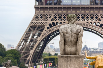 Fototapeta na wymiar Eiffel Tower and Sculptures in Trocadero in Paris, France.