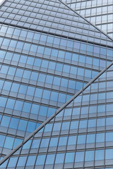 Fototapeta na wymiar Skyscrapers with glass facade. Modern buildings in Paris business district. Concepts of economics, financial, future. Copy space for text. Dynamic composition.