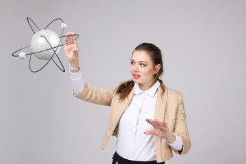 Woman scientist with atom model, research concept