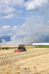 Field burning of smoke and tractor