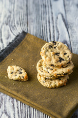 Stack of homemade cookies with cheese, olives and rosemary