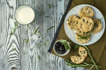 Olive and rosemary cookies and milk glass