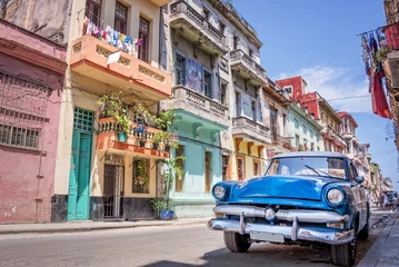 Printed roller blinds Central-America Blue vintage classic american car in a colorful street of Havana, Cuba. Travel and tourism concept.