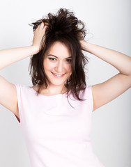 beautiful brunette woman tearing her hair and looks shocked. girl flirting concept. expression of different emotions