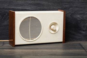 Antique radio on vintage background. Copy Space.
