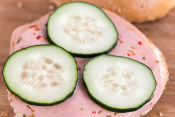 Salami sandwich with sliced cucumber