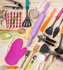 cookware and accessories on a wooden table.