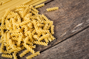 Mixed pasta . On a wooden background. Top view