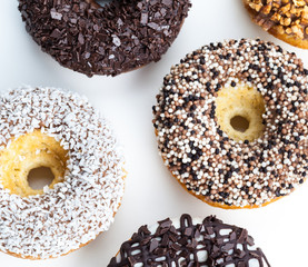 various donuts on white background