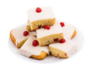 Square cake with cherry on