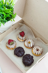 Colorful donuts in box