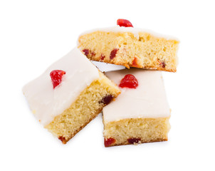 Square cake with cherry on