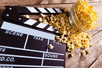 Movie clapper board and pop corn