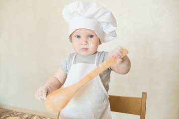 The little boy in a suit of the cook