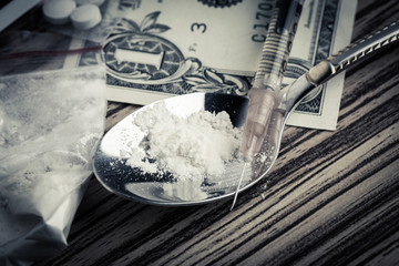 Fototapeta premium Drug syringe and cooked heroin on spoon