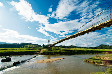 Wooden bridge over a spring in the highland of the middle of Vietnam
