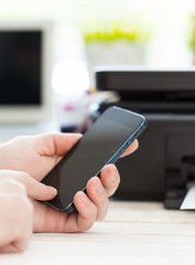 Unrecognizable man using mobile phone