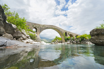 Old Mes Bridge (Albanian: Ura e Mesit) near Shkoder in Albania - obrazy, fototapety, plakaty