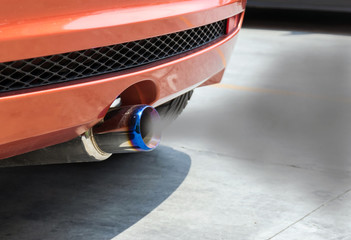 The smoke from the exhaust of a car when the engine starts.
