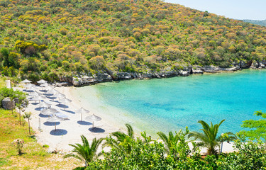 Beautiful small beach with umbrellas.