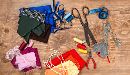 Cotton fabrics for sewing, spool of thread, scissors, buttons, measuring tape and accessories for...