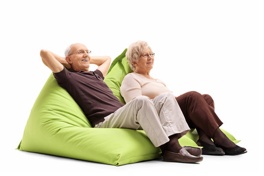 Elderly couple sitting on beanbags