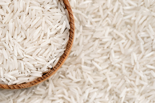 White long rice in cup . Close up, top view, high resolution pro