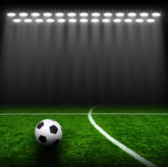 Soccer ball on green stadium