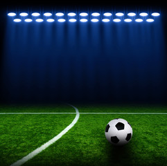 Soccer ball on green stadium