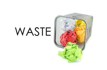 conceptual image of green, red and yellow waste color paper with word WASTE. isolated white background