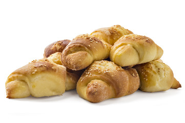 Fresh Serbian pastry rolls with cheese and sesame, kifla, kiflice, isolated on white background