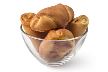 Fresh bavarian pastries rolls, kifla kiflice, in the glass bowl, isolated on white background