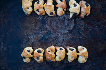 Small croissants on a metal tray